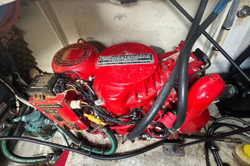 Slide: The Image of Red Westerbeke engine in a 2007 Sea Ray 240 Sundancer boat compartment. - 34
