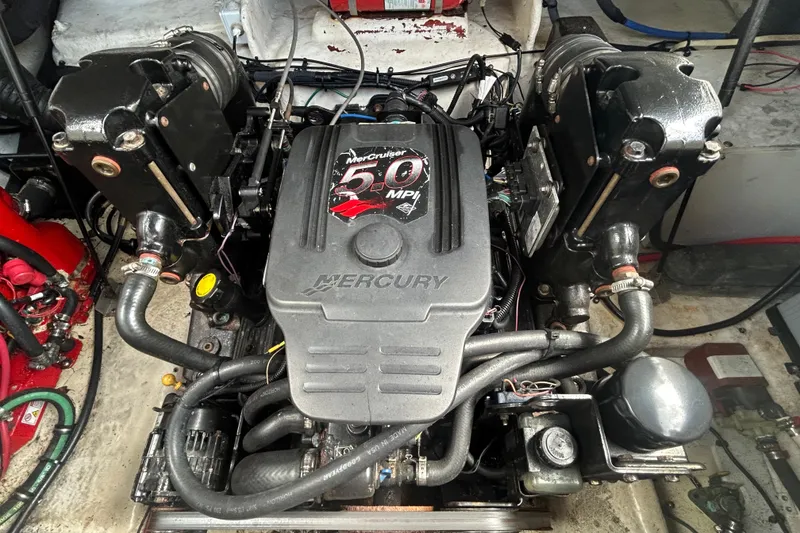 Slide: The Image of Engine of a 2007 Sea Ray 240 Sundancer boat, featuring a MerCruiser 5.0 MPI. - 35