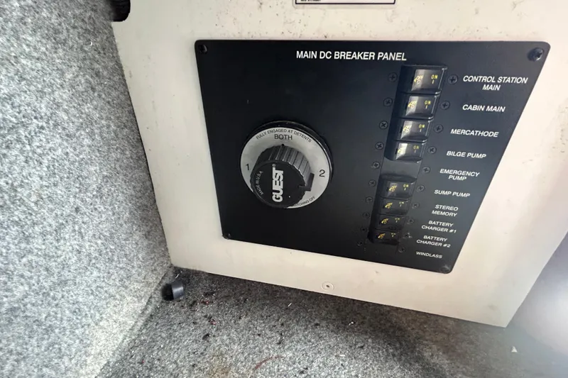 Slide: The Image of Main DC breaker panel on 2007 Sea Ray 240 Sundancer boat, featuring various control switches. - 37