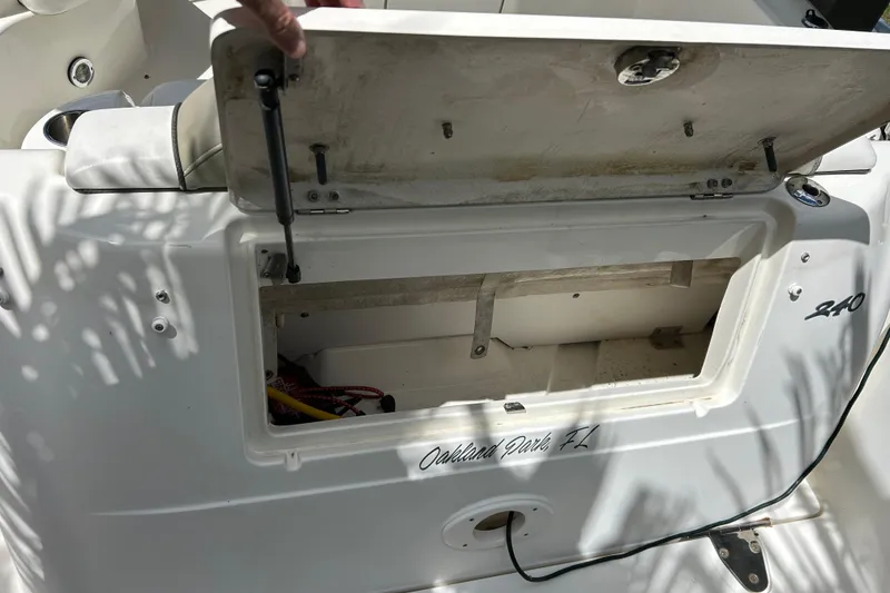 Slide: The Image of Open storage compartment on a 2007 Sea Ray 240 Sundancer boat. - 44