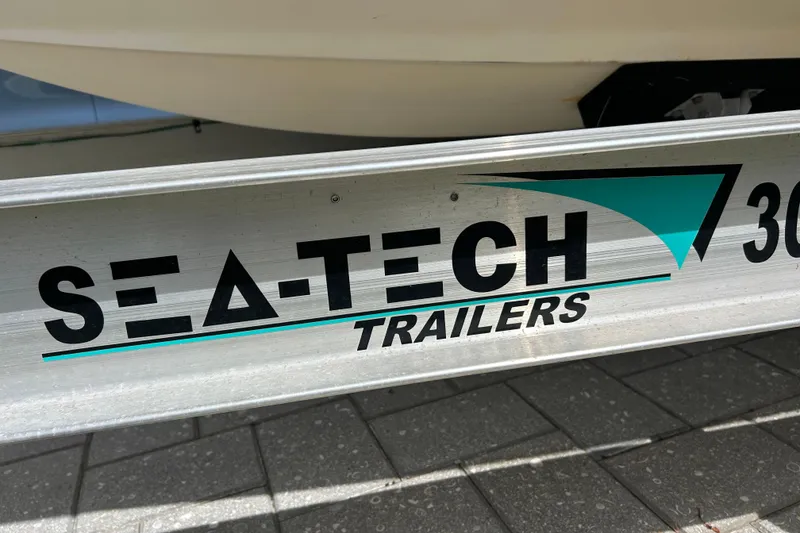 Slide: The Image of Sea-Tech Trailers logo on a 2007 Sea Ray 240 Sundancer boat trailer. - 46