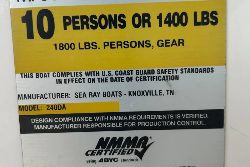Slide: The Image of Capacity label for 2007 Sea Ray 240 Sundancer, 10 persons or 1400 lbs, NMMA certified. - 49