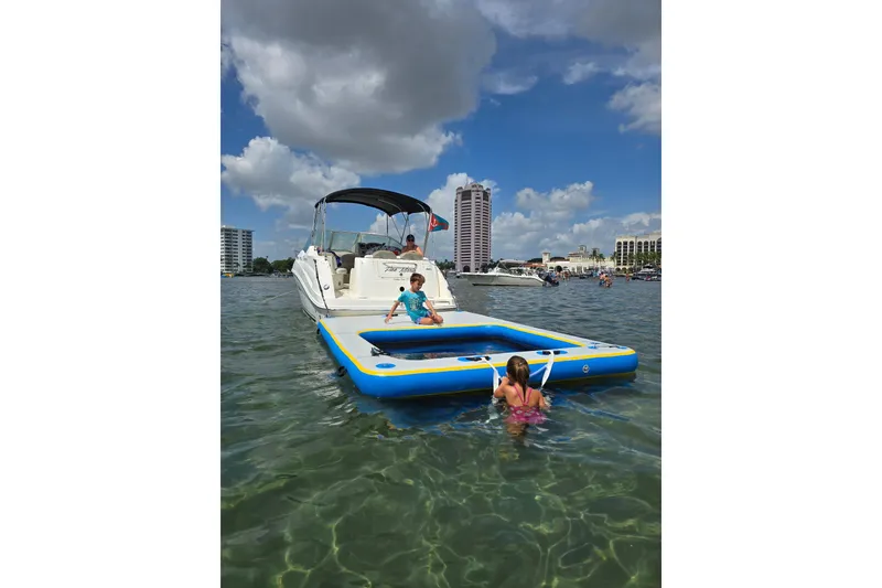 Slide: The Image of 2007 Sea Ray 240 Sundancer with inflatable platform on a sunny day. - 54