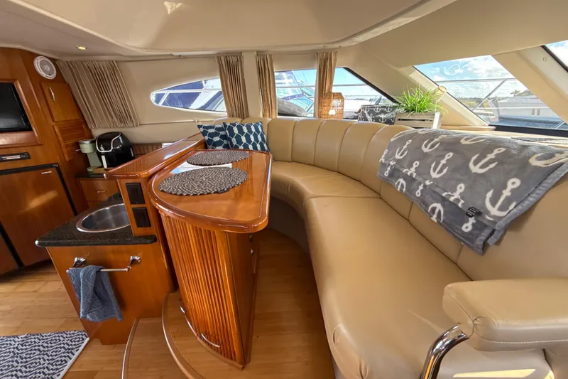 Slide: The Image of Luxurious interior of 2005 Carver 36 Sedan with plush seating and elegant wood finishes. - 23
