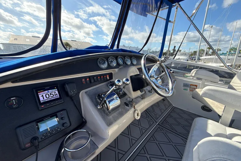 Slide: The Image of Interior helm of 2005 Carver 36 Sedan with steering wheel and navigation instruments. - 30