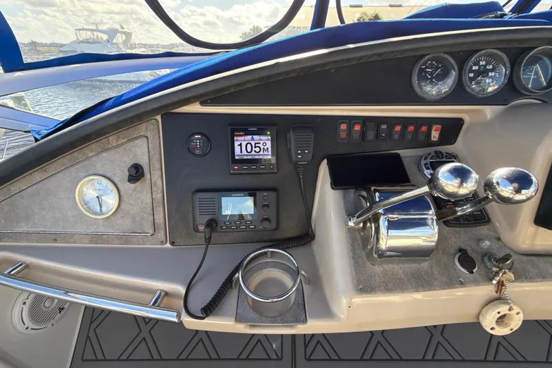Slide: The Image of Dashboard of a 2005 Carver 36 Sedan boat with navigation instruments and controls. - 33