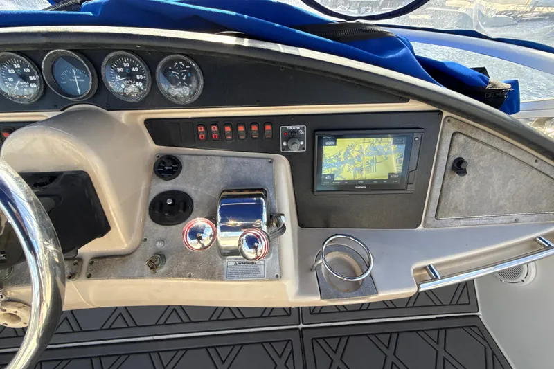 Slide: The Image of Helm of 2005 Carver 36 Sedan with navigation system and gauges. - 34