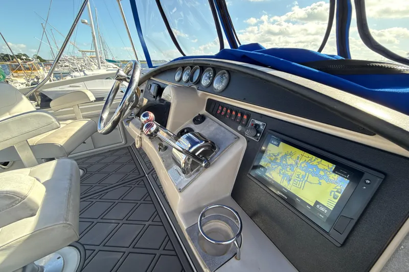 Slide: The Image of Helm of 2005 Carver 36 Sedan with navigation system and controls. - 35