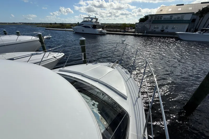 Slide: The Image of 2005 Carver 36 Sedan yacht docked at marina, sunny day, calm water. - 39