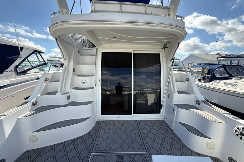Slide: The Image of 2005 Carver 36 Sedan yacht with spacious deck and sliding glass doors. - 44
