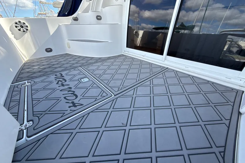 Slide: The Image of 2005 Carver 36 Sedan yacht deck with custom non-slip flooring and sleek design. - 47
