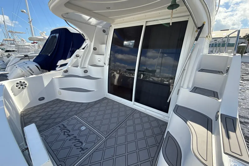 Slide: The Image of 2005 Carver 36 Sedan yacht deck with stairs and sliding glass doors. - 49