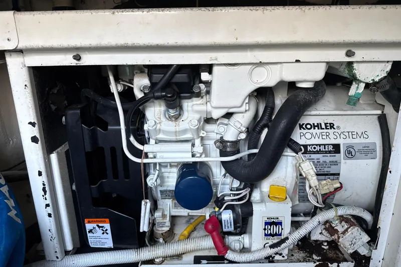 Slide: The Image of Engine compartment of a 2005 Carver 36 Sedan with Kohler power systems. - 52