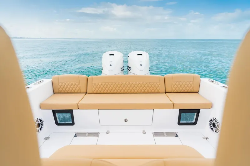 Slide: The Image of 2026 Sportsman Heritage 321 Center Console boat with tan seating, ocean view. - 7