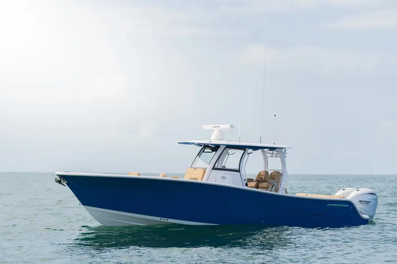 The Image of 2026 Sportsman Heritage 321 Center Console boat on calm ocean waters. - 0