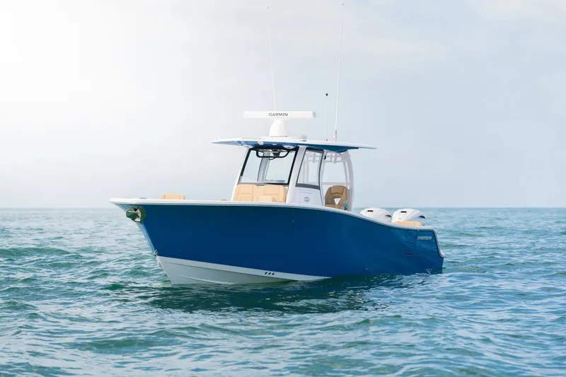 Slide: The Image of 2026 Sportsman Heritage 321 Center Console boat on open water. - 1
