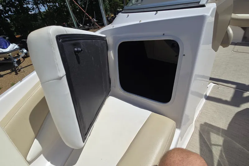 Slide: The Image of 2015 Regal 1900 Bowrider boat interior with open storage compartment. - 14