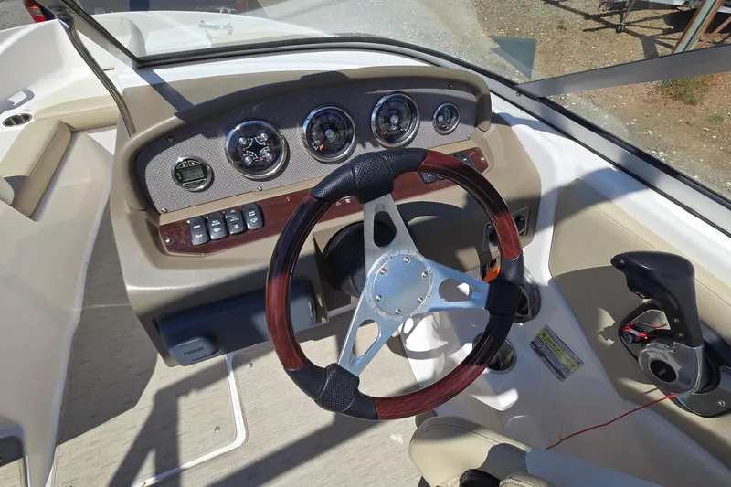 Slide: The Image of 2015 Regal 1900 Bowrider dashboard with steering wheel and control panel. - 18