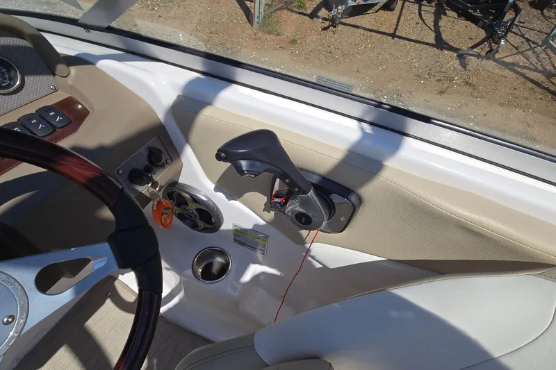 Slide: The Image of 2015 Regal 1900 Bowrider dashboard with steering wheel and control panel. - 19