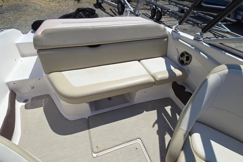 Slide: The Image of 2015 Regal 1900 Bowrider interior with beige seating and speaker detail. - 25