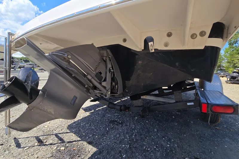 Slide: The Image of 2015 Regal 1900 Bowrider boat on trailer, showing propeller and stern drive. - 34