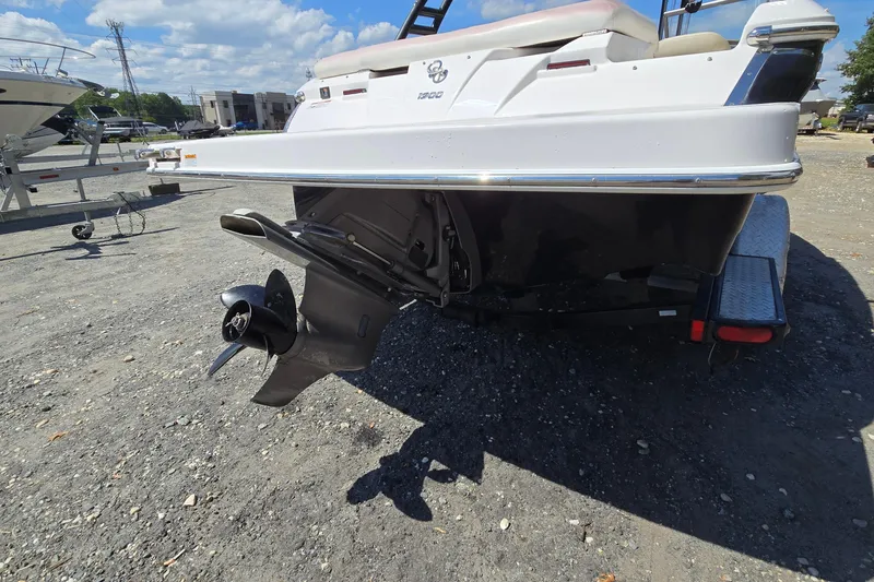 Slide: The Image of 2015 Regal 1900 Bowrider boat on trailer, rear view with outboard motor. - 7