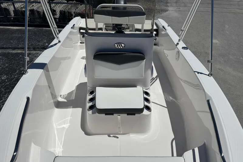 Slide: The Image of 2025 Robalo R160 Center Console boat interior with seating and console view. - 12