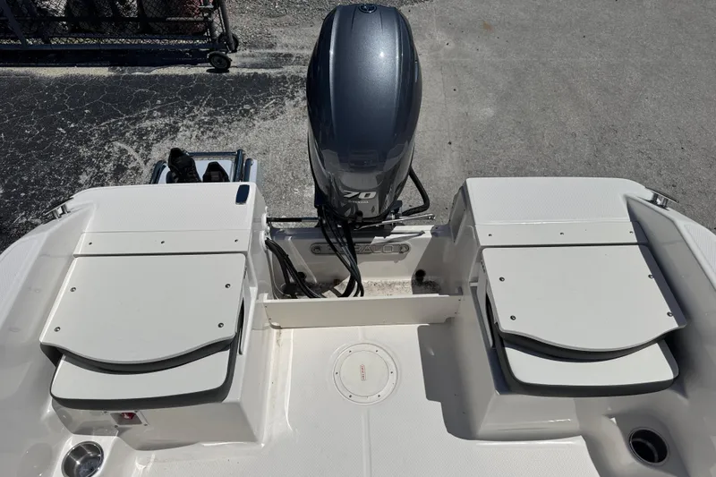 Slide: The Image of 2025 Robalo R160 Center Console boat with outboard motor, rear view. - 15