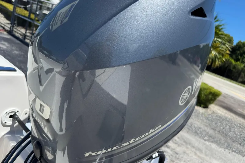 Slide: The Image of 2025 Robalo R160 Center Console with Yamaha four-stroke engine, outdoor setting. - 18