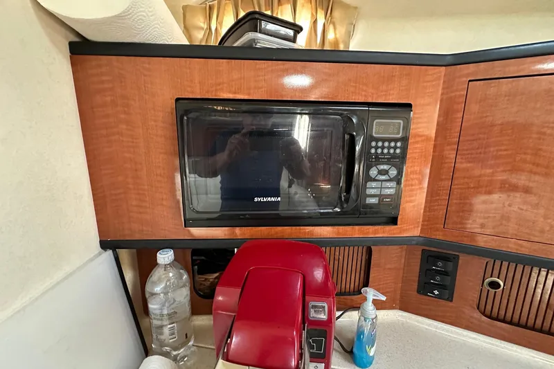 Slide: The Image of Microwave and appliances in 2005 Sea Ray 300 Sundancer boat kitchen area. - 29