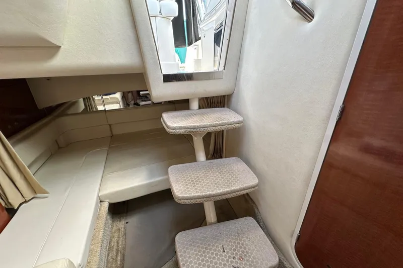 Slide: The Image of Interior of 2005 Sea Ray 300 Sundancer with steps and seating area. - 33