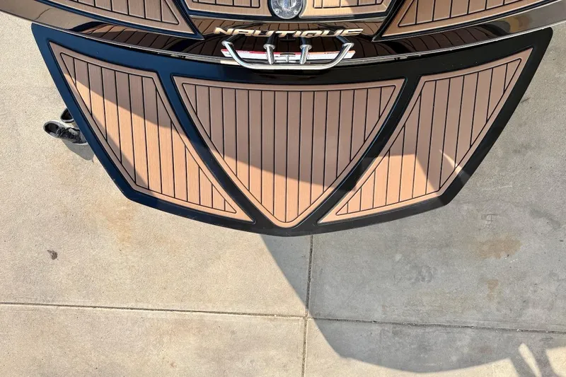 Slide: The Image of 2020 Nautique Super Air Nautique 230 swim platform with teak-style decking. - 12