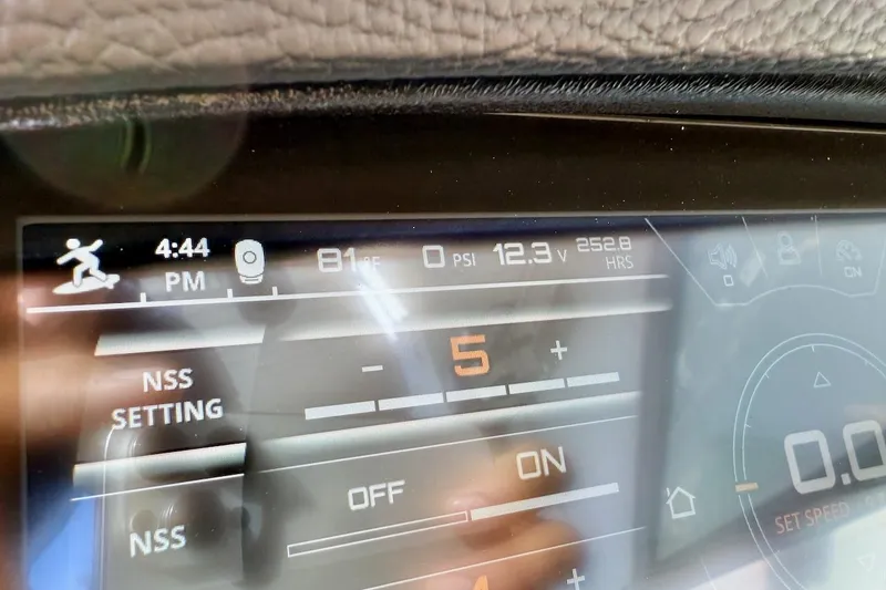Slide: The Image of Dashboard of a 2020 Nautique Super Air Nautique 230 showing settings and metrics. - 17