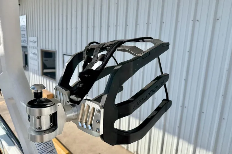 Slide: The Image of Wakeboard rack on 2020 Nautique Super Air Nautique 230 boat, mounted on metal frame. - 19