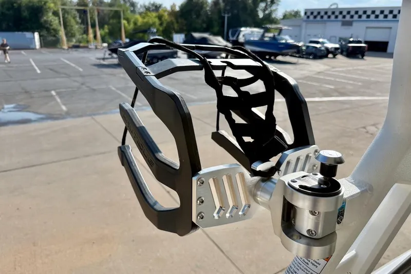 Slide: The Image of Wakeboard rack on 2020 Nautique Super Air Nautique 230, parked in a lot. - 20