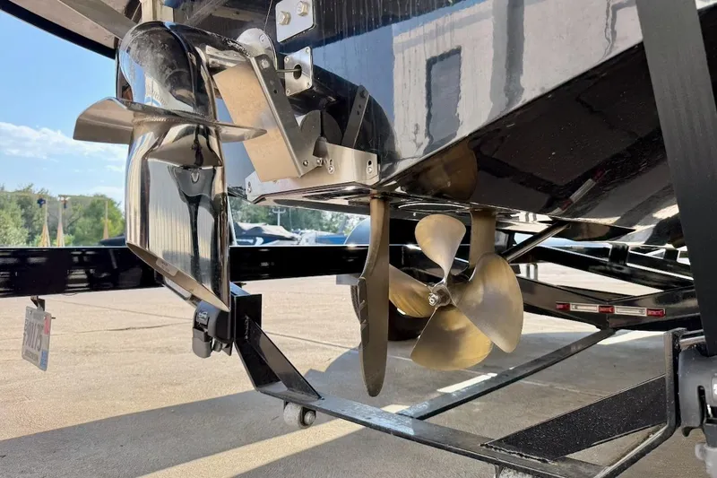 Slide: The Image of 2020 Nautique Super Air Nautique 230 boat propeller and rudder detail. - 6