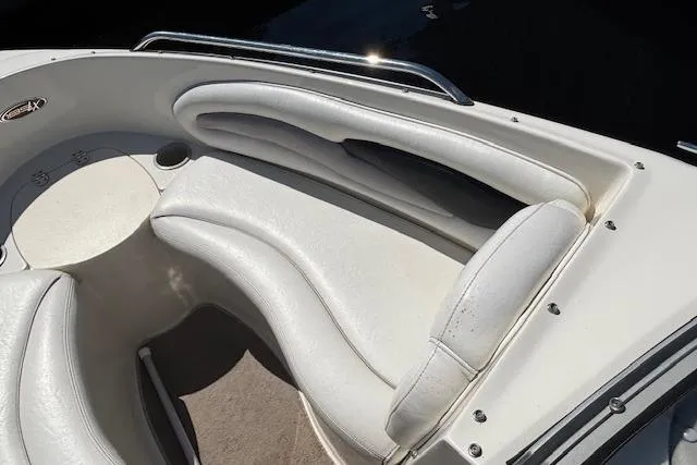 Slide: The Image of 2008 Stingray 185 LX boat interior with white cushioned seating. - 10