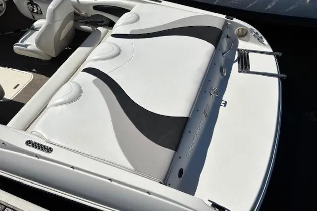 Slide: The Image of 2008 Stingray 185 LX boat interior with white and black seating, rear view. - 3