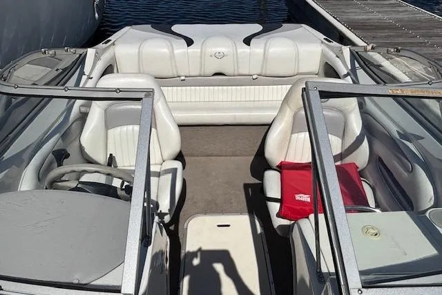 Slide: The Image of 2008 Stingray 185 LX boat interior with white seating and red life jacket. - 6