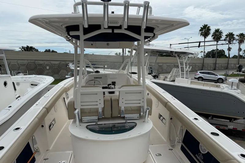 Slide: The Image of 2016 Pursuit C 280 Center Console boat with seating and control panel. - 1