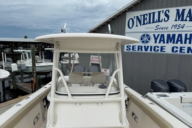 Slide: The Image of 2016 Pursuit C 280 Center Console boat at marina service center. - 16