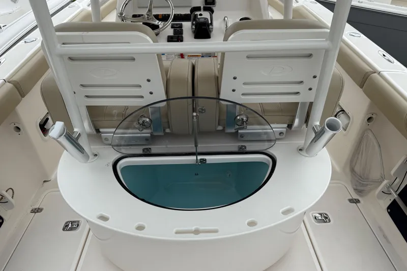Slide: The Image of 2016 Pursuit C 280 Center Console boat interior with seating and storage compartments. - 3