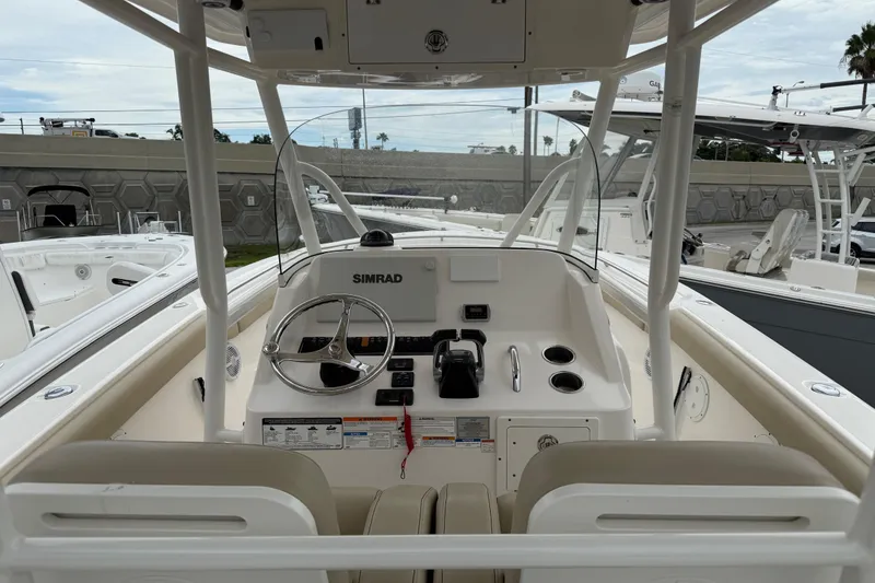 Slide: The Image of 2016 Pursuit C 280 Center Console boat interior with steering wheel and controls. - 5