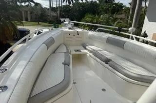 Slide: The Image of 2015 Mako 284 Center Console boat with spacious seating and sleek design. - 6