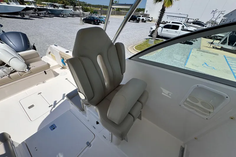 Slide: The Image of 2015 Pursuit OS 285 Offshore boat interior with comfortable seating and modern design. - 23
