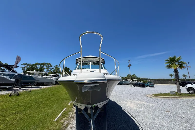 Slide: The Image of 2015 Pursuit OS 285 Offshore boat displayed outdoors under clear blue sky. - 7
