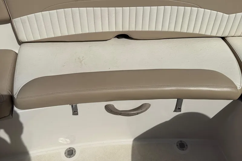 Slide: The Image of 2014 Stingray 208 LR boat seat with beige and white upholstery. - 15