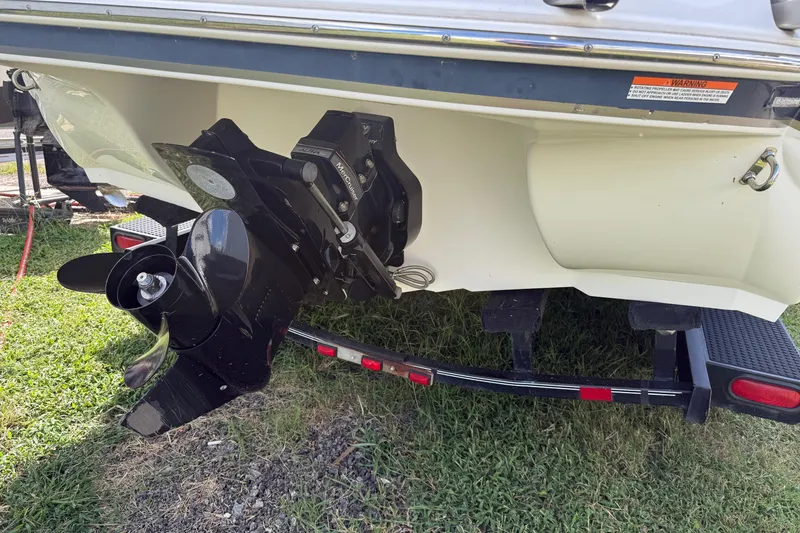 Slide: The Image of Rear view of a 2014 Stingray 208 LR boat on a trailer, showing the propeller. - 26