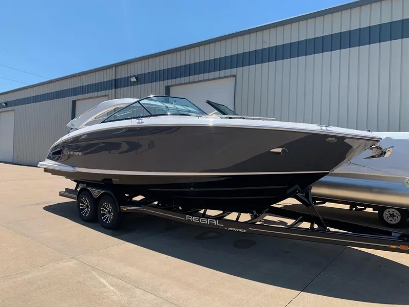 The Image of 2022 Regal 2800 Bowrider boat displayed outdoors on a sunny day. - 0