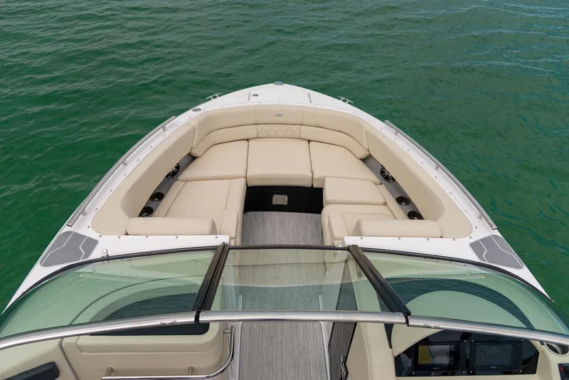Slide: The Image of 2022 Regal 2800 Bowrider interior with sleek design, cup holders, and speaker system. - 12